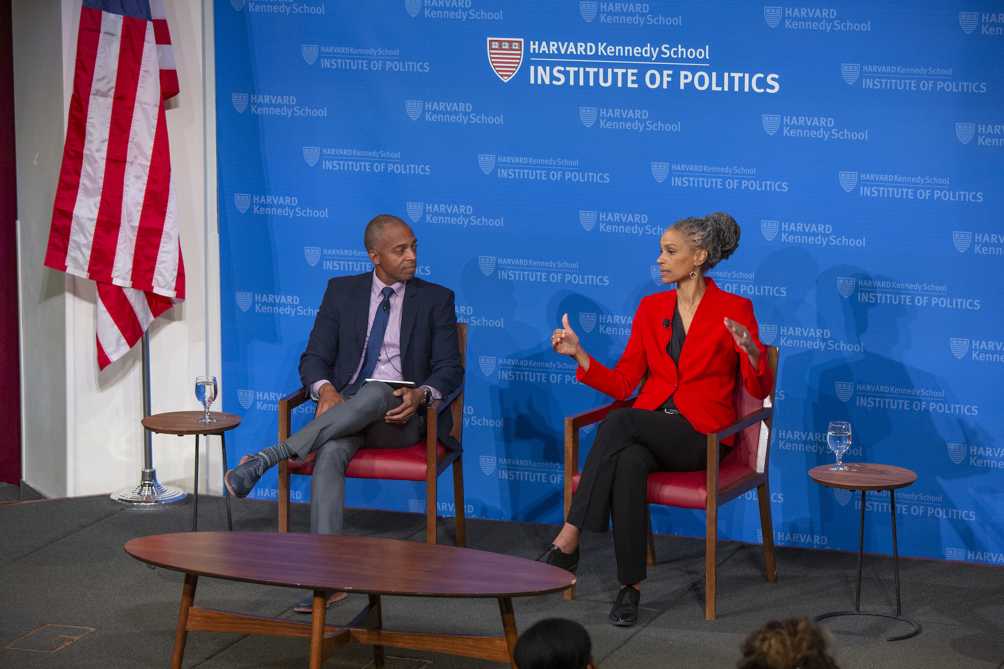 Professor Khalil Gibran Muhammad and Maya Wiley seated in JFK Forum with Maya Wiley speaking