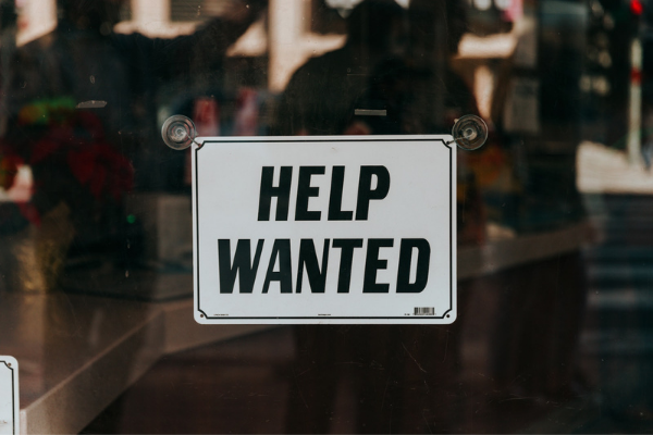 "Help wanted" sign in window