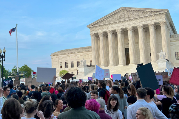 Protestors stand in front of the Supreme Court