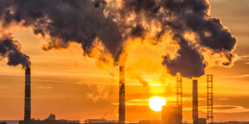greenhouse gas with sunset in the background