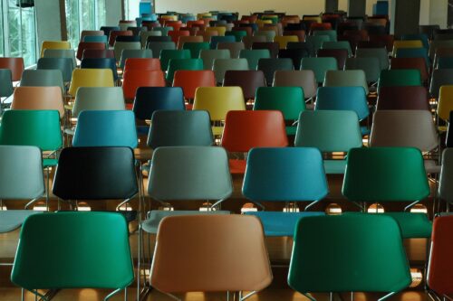 Photo of colorful classroom chairs in rows