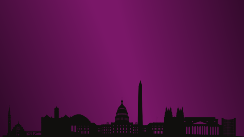 a purple and black sky behind a silhouette of a city scape