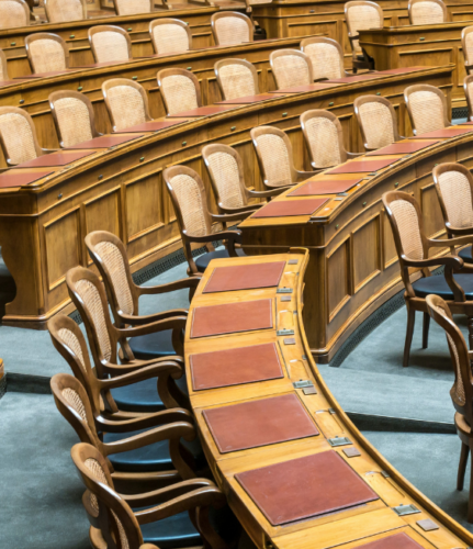 A photo of a row of chairs in an assembly room