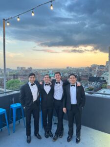 Cortez with friends on a rooftop 