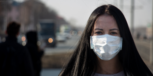 A woman wearing a face mask during COVID-19.