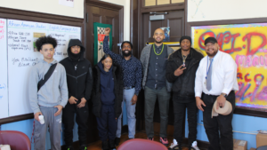 Board with students at Community Academy in Jamaica Plain. 