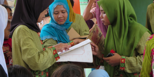 Indonesian women looking at a document