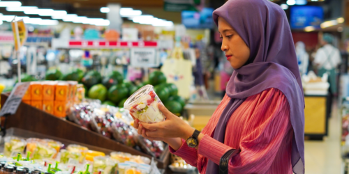 Woman looking at grocery product