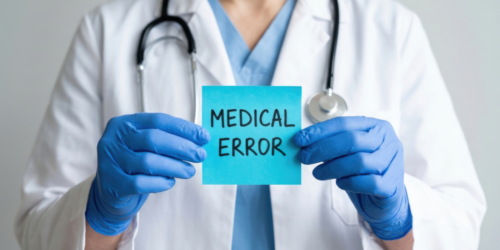Doctor holding medical error note