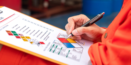 Worker looking at chemical checklist